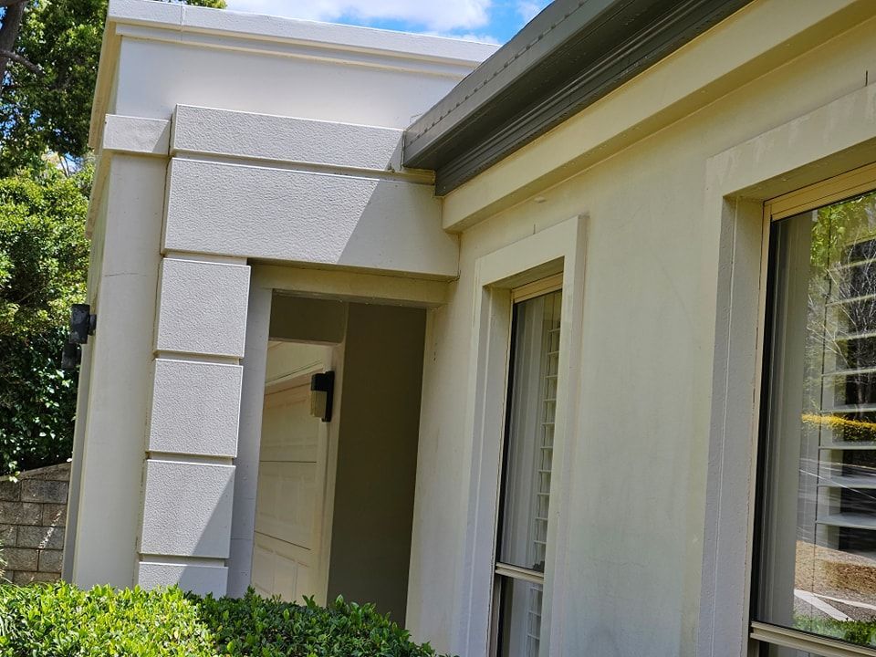 A white house with a lot of windows and a porch. — O & D House Wash & Cleaning Services in Westbrook, QLD