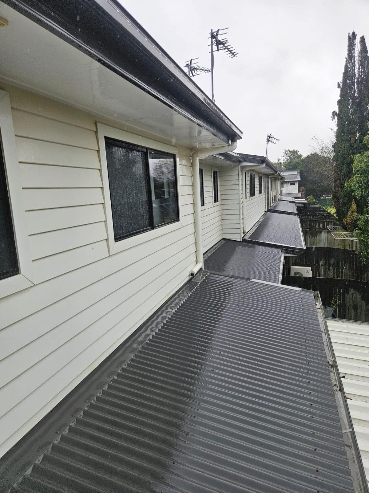 A White House With a Black Roof — O & D House Wash & Cleaning Services in Cambooya, QLD