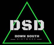 Logo for Down South Dirtworx, with "DSD" in white block letters inside a green triangle. Black background.