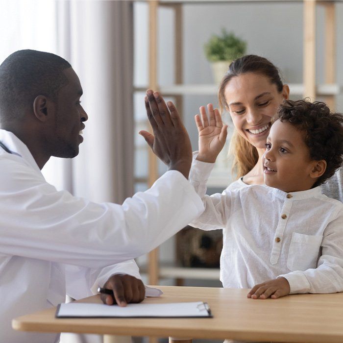 Mother and Son With Physician