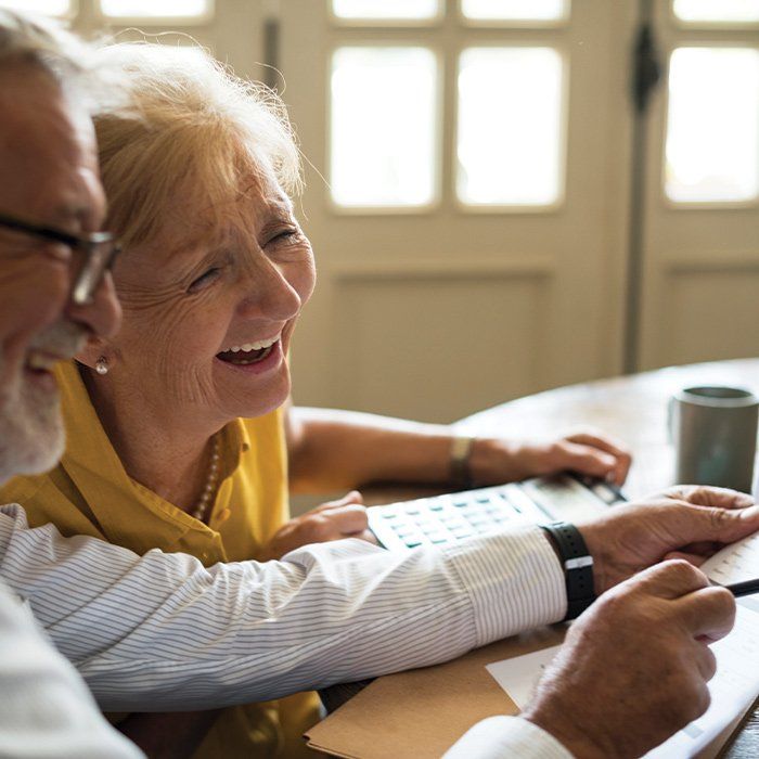 Elderly Couple Laughing at Home