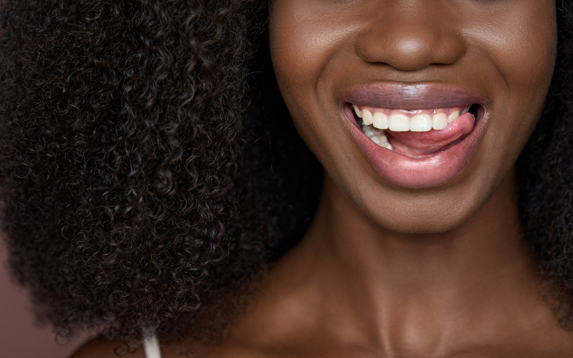 Happy young girl smiling and flaunting her white teeth