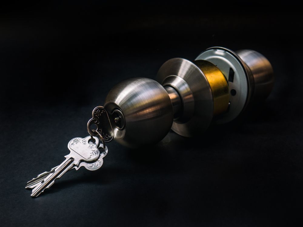 A Close Up Of A Door Knob With Keys In It — Dependable Locksmiths In Nabiac, NSW