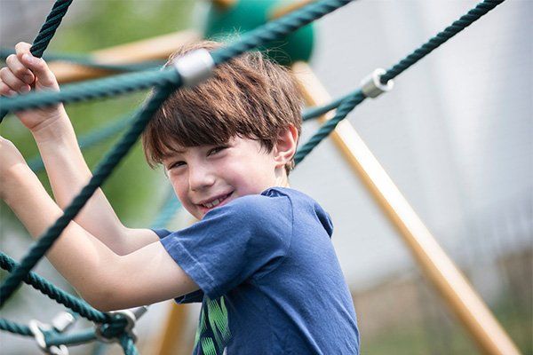 Young Boy on a Rope Net — Mokena, IL — Triple R Child Care