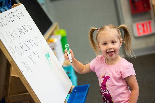 Girl Holding a Marker — Mokena, IL — Triple R Child Care