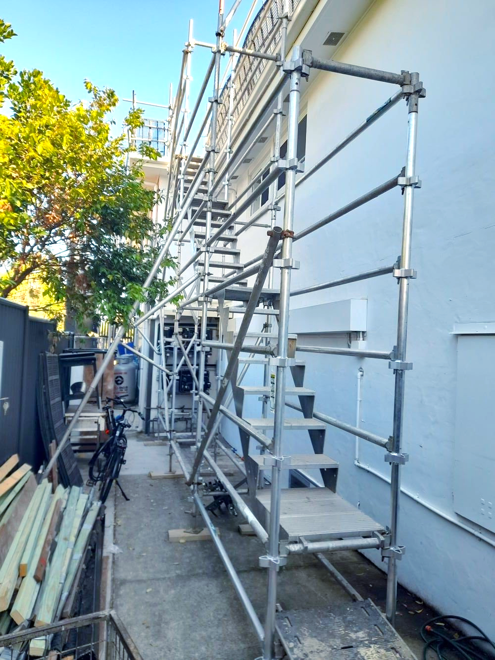 A staircase is being built on the side of a building.