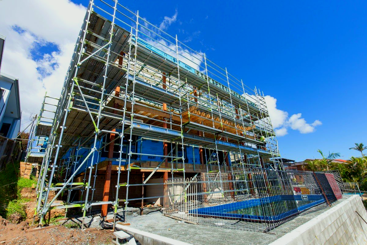 A large building is being built with scaffolding around it.