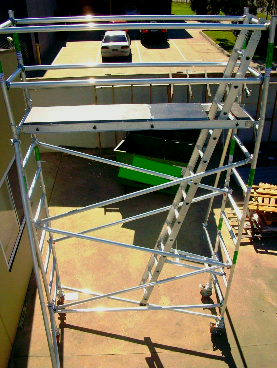 A metal scaffolding with a ladder on top of it.
