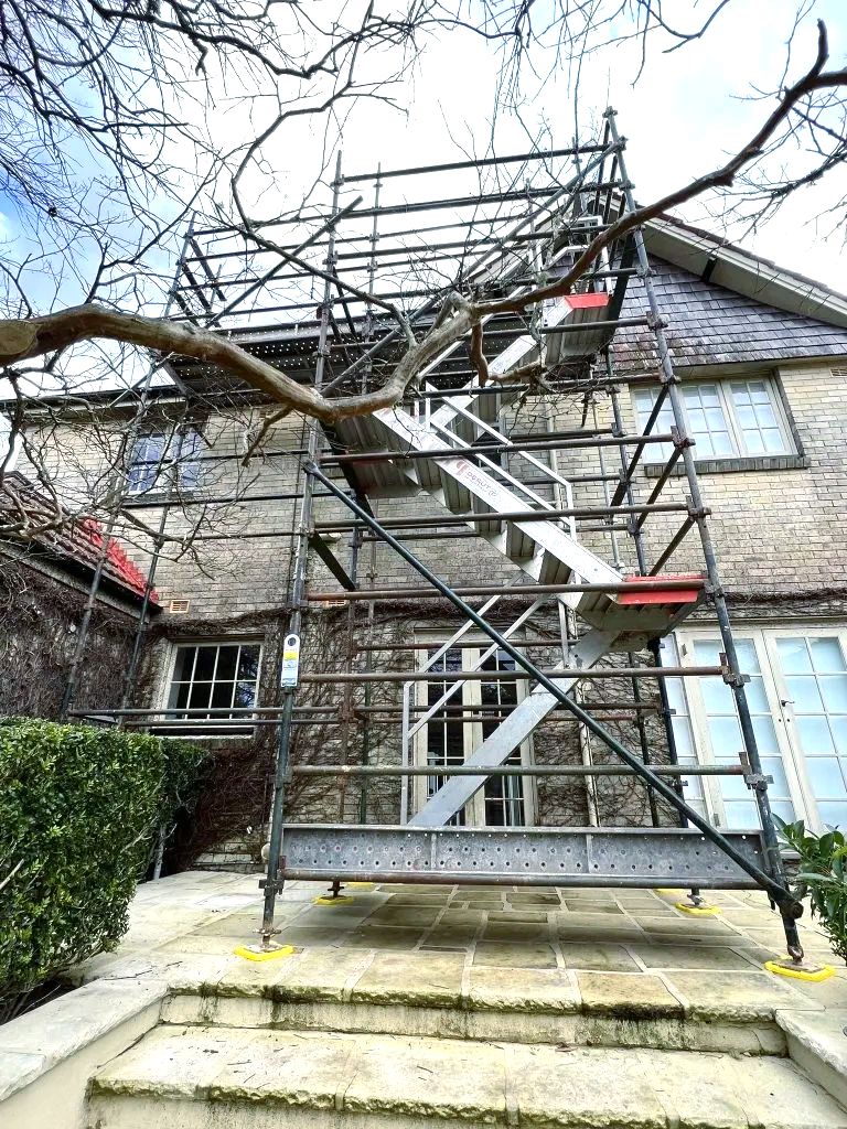 A staircase is being built on the side of a house.