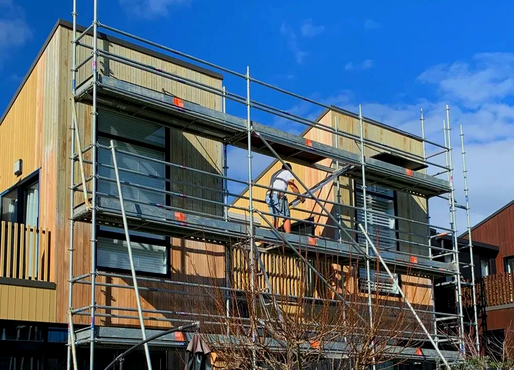 A house is being built with scaffolding around it.