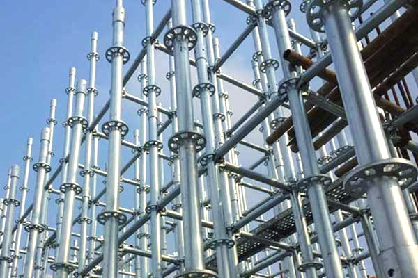 A row of metal scaffolding against a blue sky.