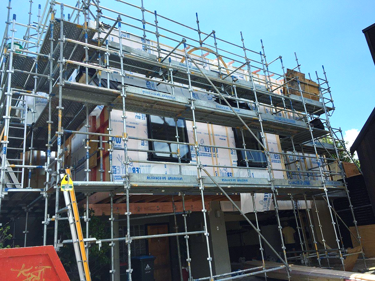 A building is being built with scaffolding around it.