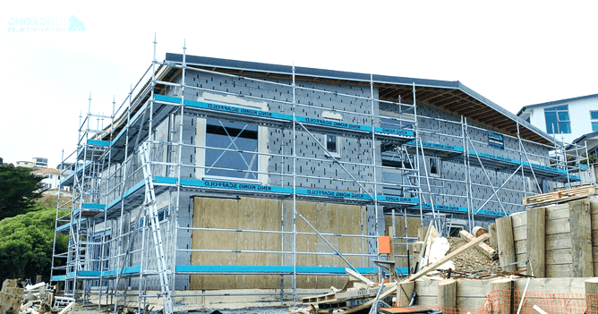 A large building is being built with scaffolding around it.