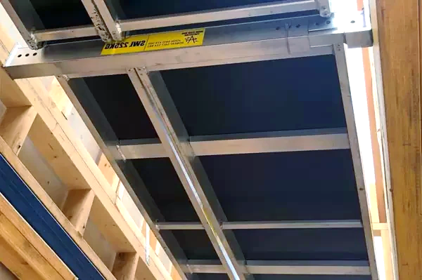 A ladder is sitting on top of a wooden ceiling in a building.