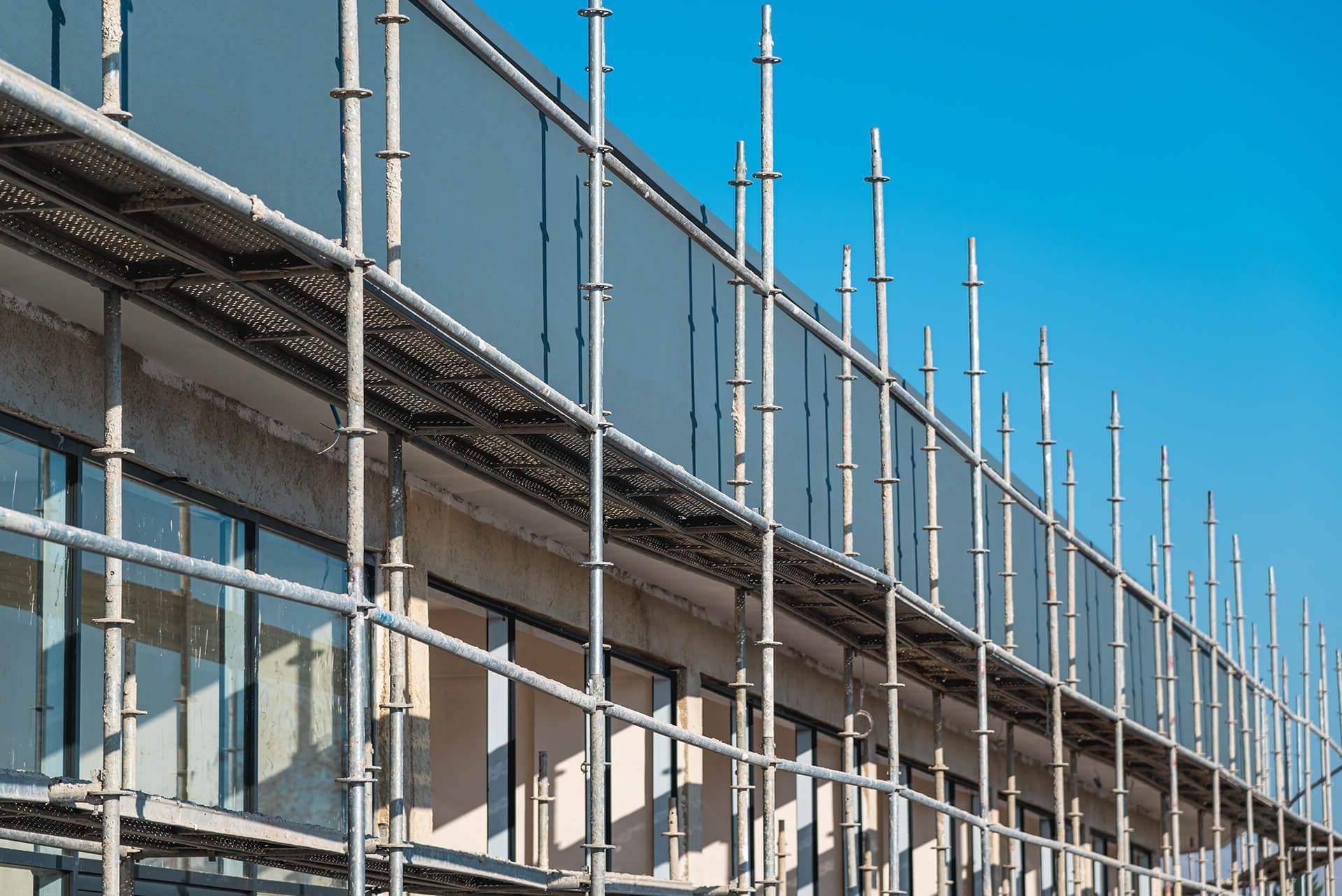 A building under construction with scaffolding on the side of it.