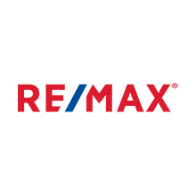 Un logo re/max rouge, blanc et bleu sur fond blanc.