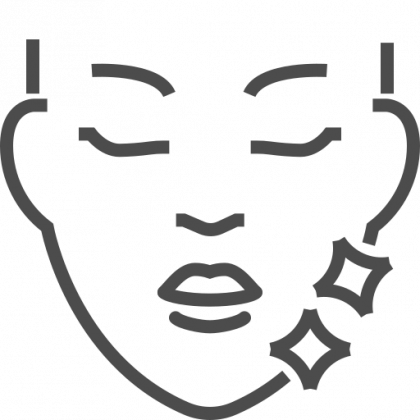 Face with closed eyes and sparkling cheeks, indicating a skincare or beauty treatment.