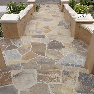 A stone walkway with stairs leading up to it