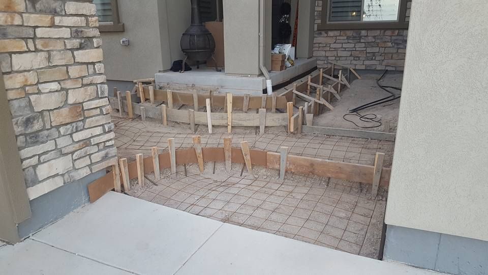 Concrete forms in preparation for pouring a curved patio.