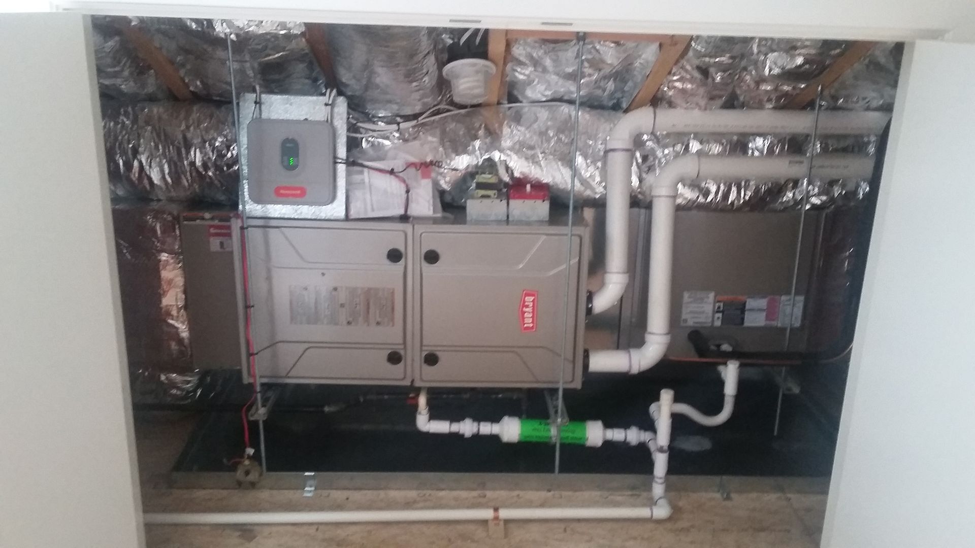 A picture of a heating system in a basement.