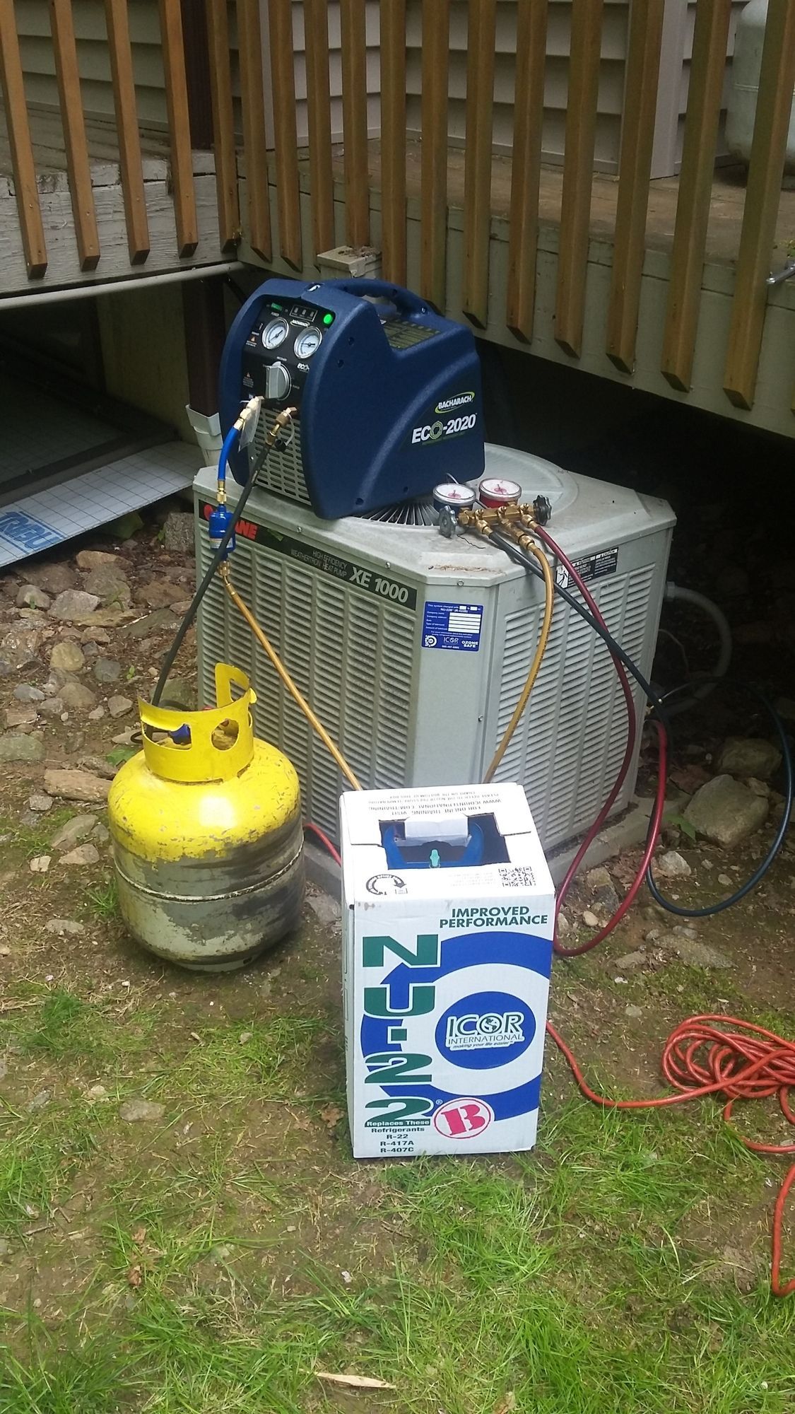 A propane tank is sitting next to a box of nitrogen.