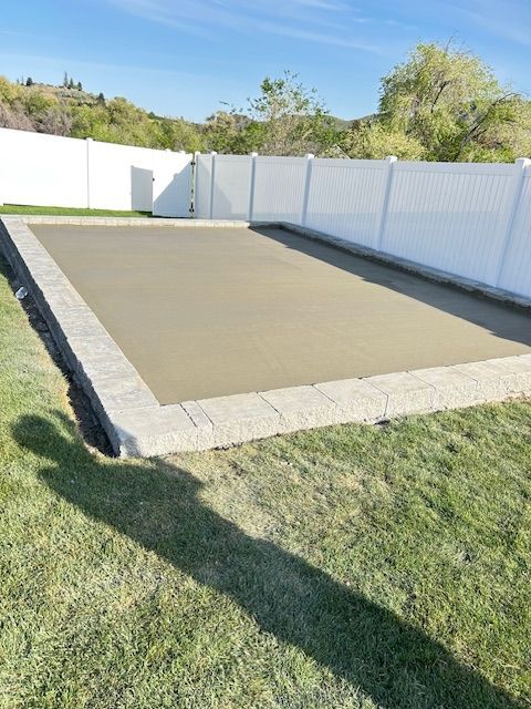 Family-owned crew preparing concrete base for an outdoor living space foundation