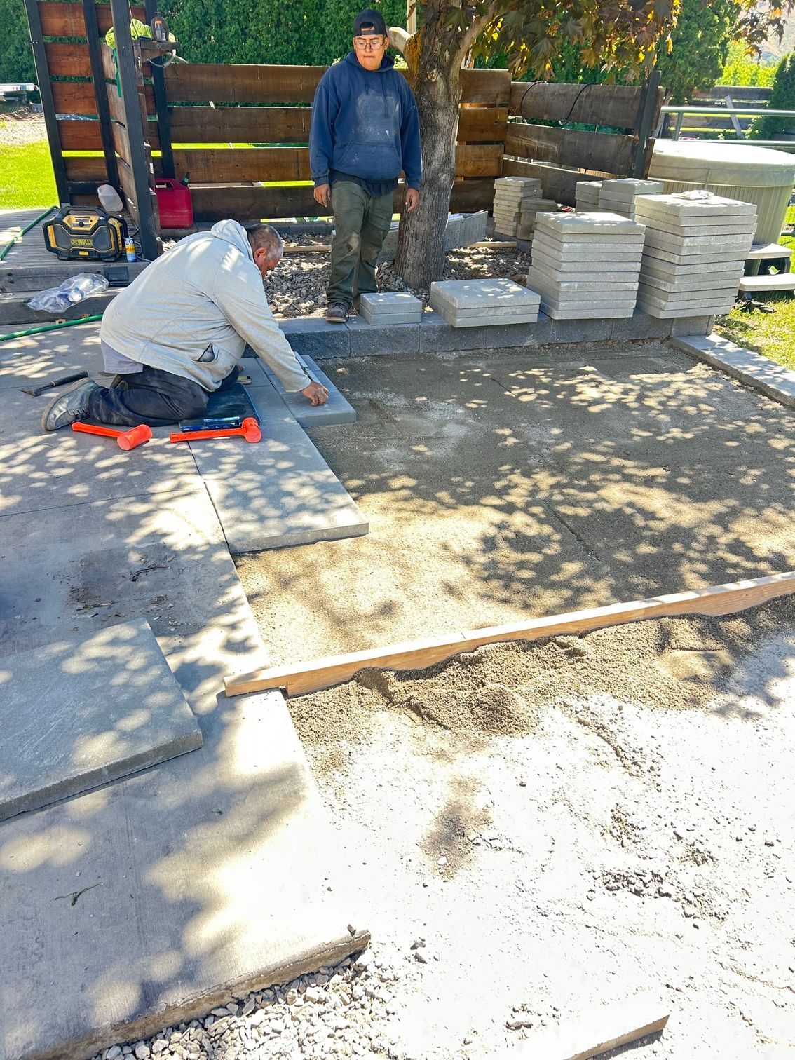 Newly installed smooth concrete patio with clean expansion joints by Wenatchee landscaping experts