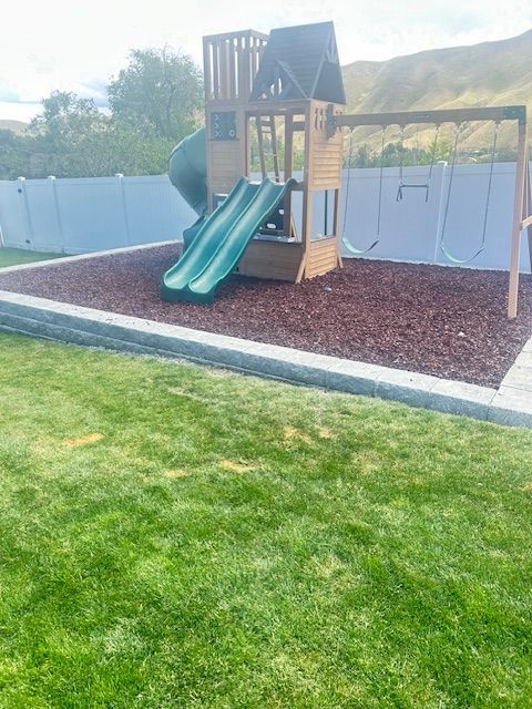 Wenatchee backyard transformed with custom hardscape patio, lush native plantings, and drip irrigation by local landscaping experts