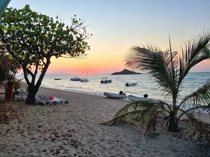 Beach scene at sunset — The Beach Bar and Restaurant at Montes in Cape Gloucester, QLD