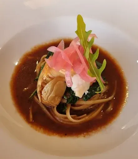 Spaghetti in brown sauce with shrimp, pink onions and greens — The Beach Bar and Restaurant at Montes in Cape Gloucester, QLD