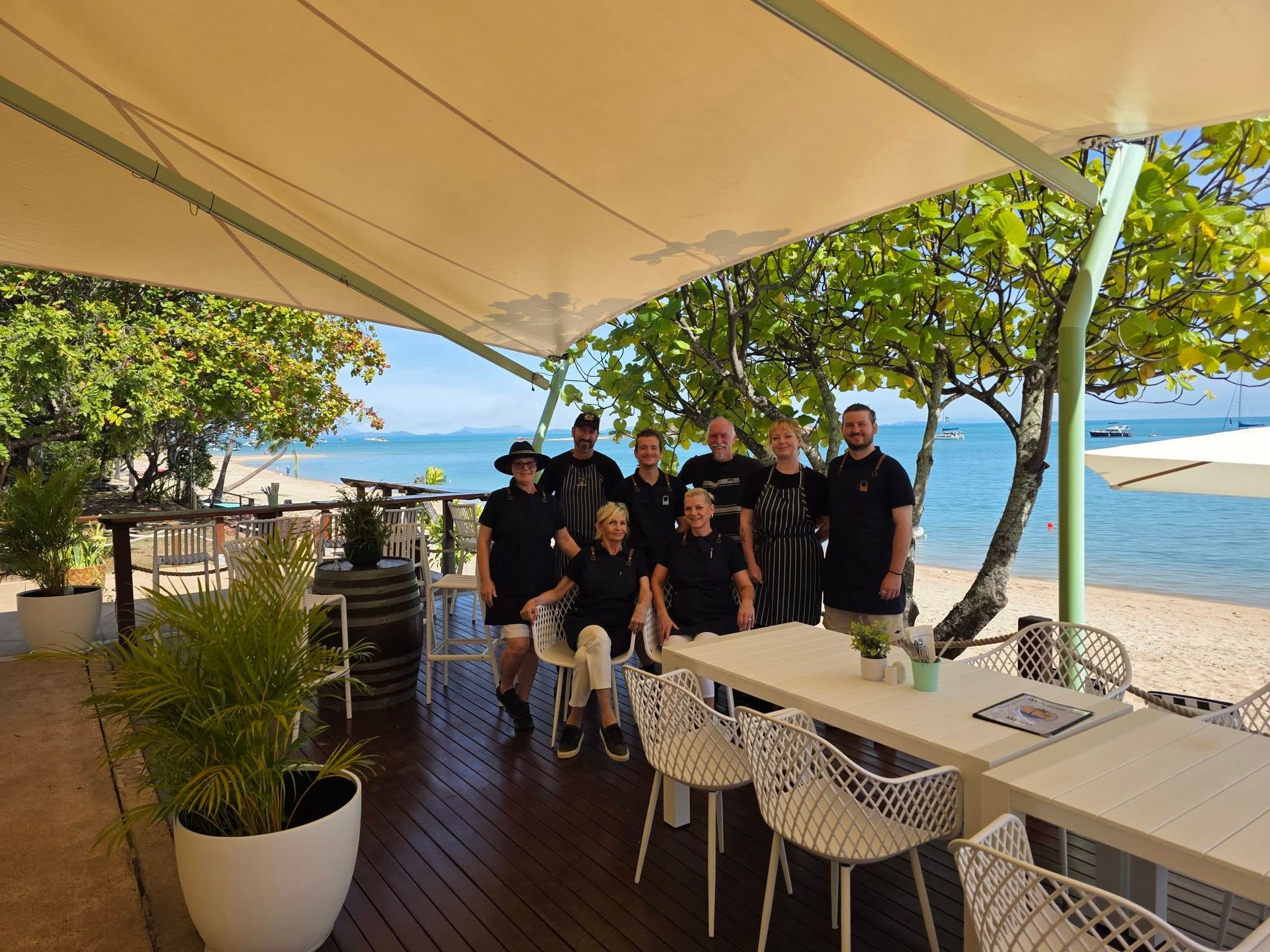 Group of People Under a Canopy on a Beach — The Beach Bar and Restaurant at Montes in Cape Gloucester, QLD