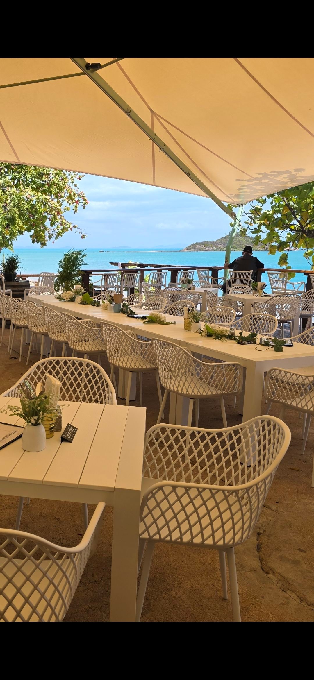 Outdoor Restaurant With White Tables — The Beach Bar and Restaurant at Montes in Cape Gloucester, QLD
