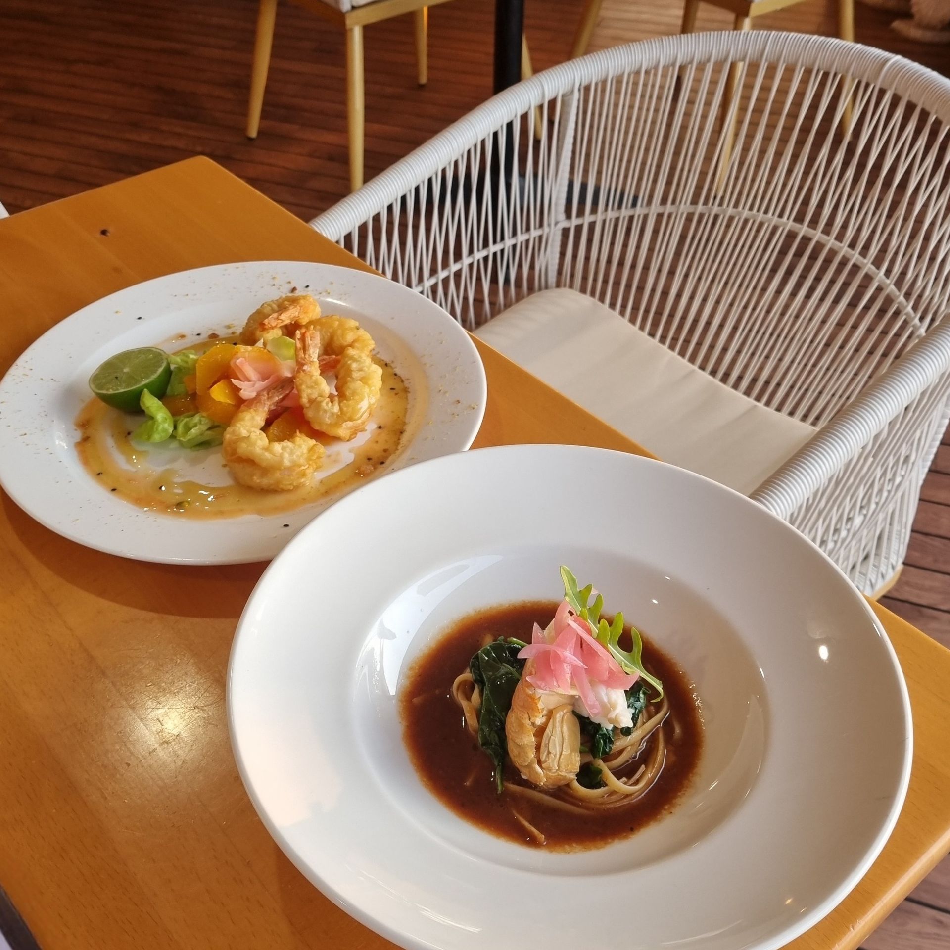 Plate of Grilled Fish With Vegetables and a Grilled Lime — The Beach Bar and Restaurant at Montes in Cape Gloucester, QLD