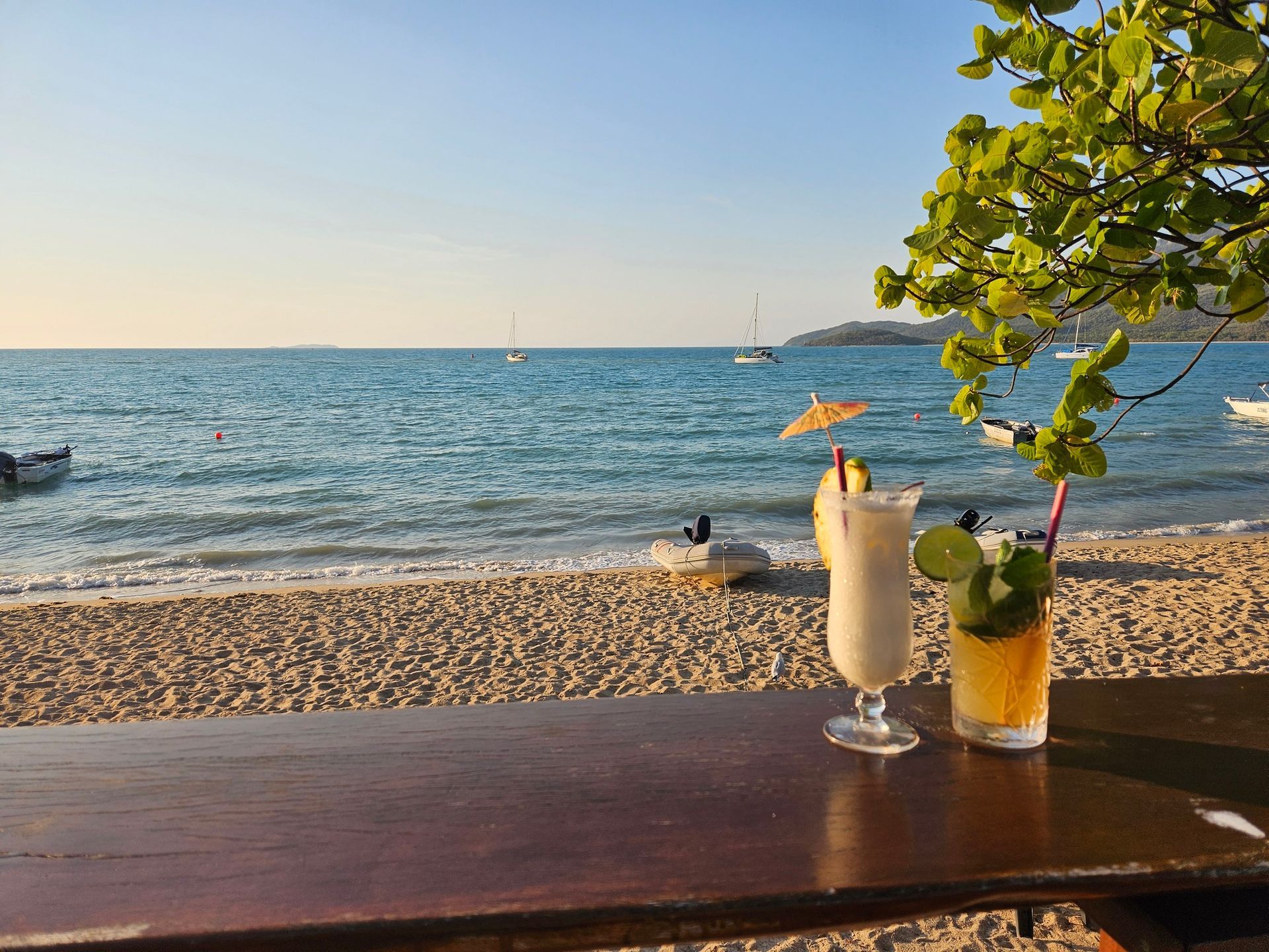 Two cocktails on a wooden bar — The Beach Bar and Restaurant at Montes in Cape Gloucester, QLD