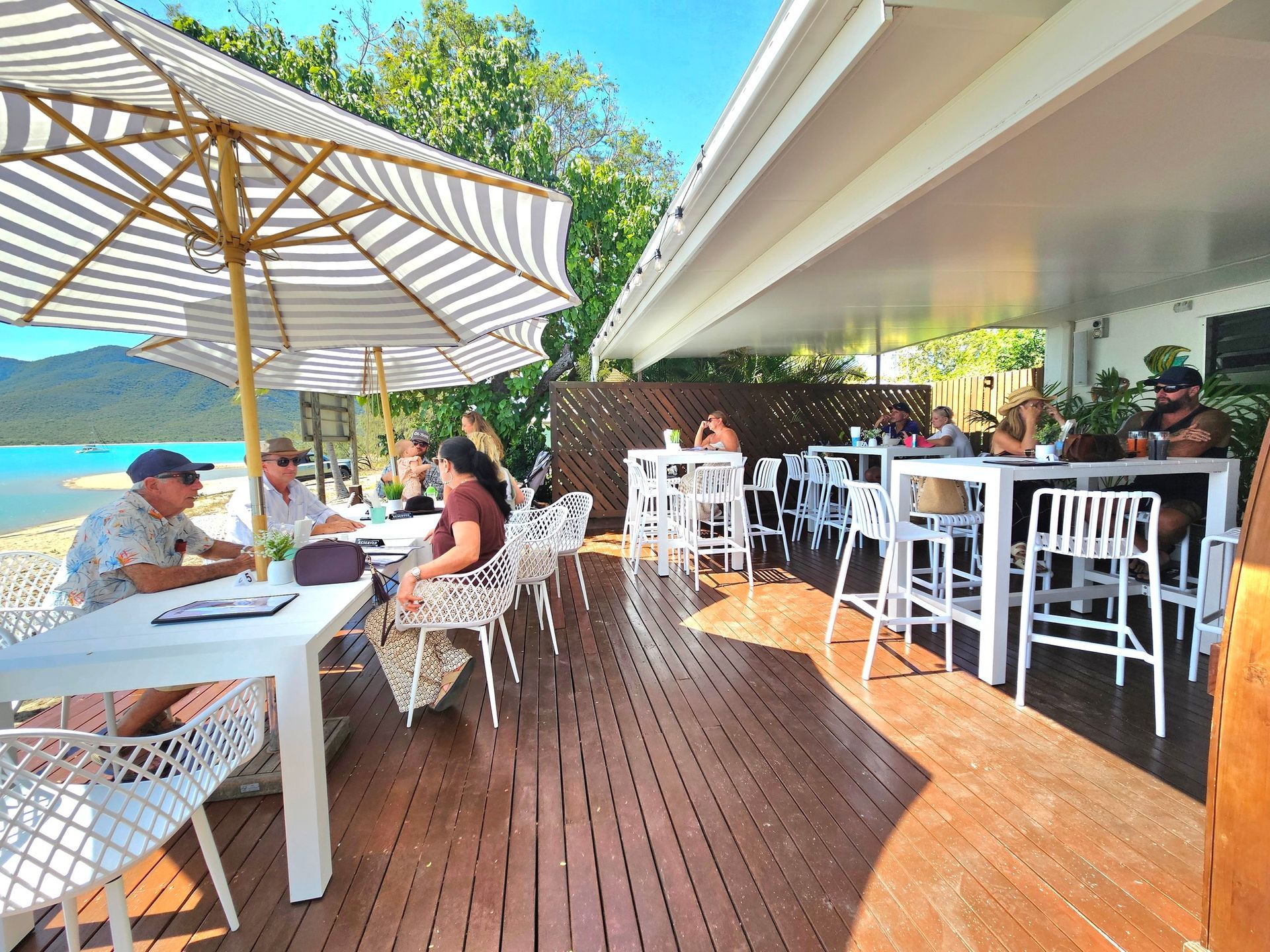 Outdoor Restaurant With White Table — The Beach Bar and Restaurant at Montes in Cape Gloucester, QLD