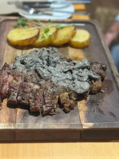 Steak with mushroom sauce and roasted potatoes — The Beach Bar and Restaurant at Montes in Cape Gloucester, QLD
