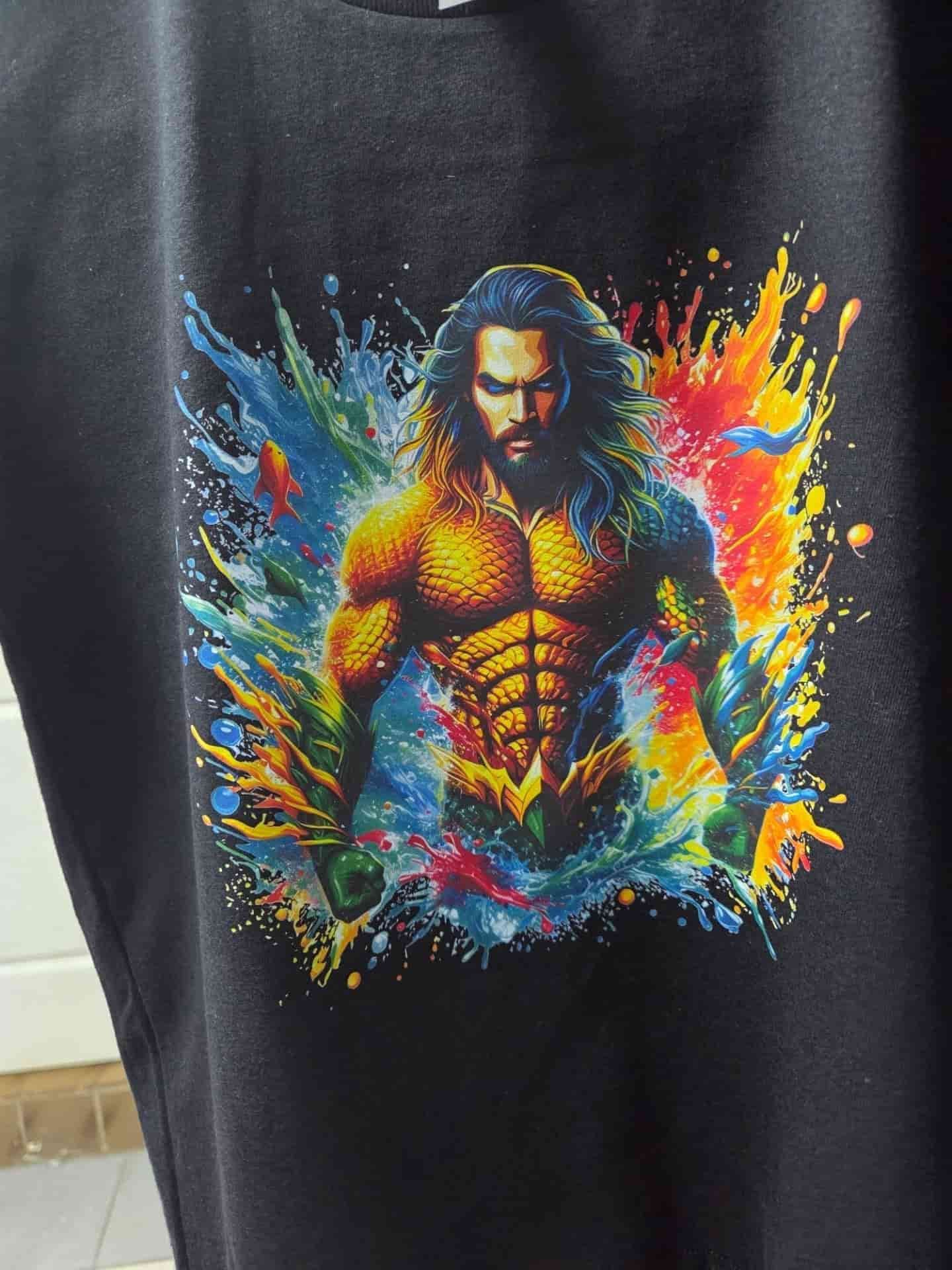 Illustration of a Muscular Superhero With Long Hair on a Black Shirt — DXMA Designs In Bargo, NSW