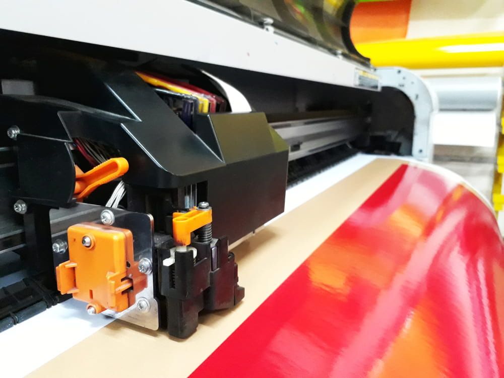 Large-format Inkjet Printer Printing a Vivid Red and Yellow Gradient on Glossy Paper — DXMA Designs In Bargo, NSW