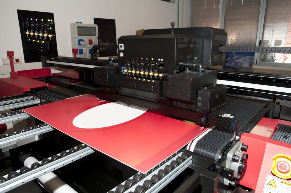 Large Industrial Printer is Printing a Red and White Poster — DXMA Designs In Bargo, NSW