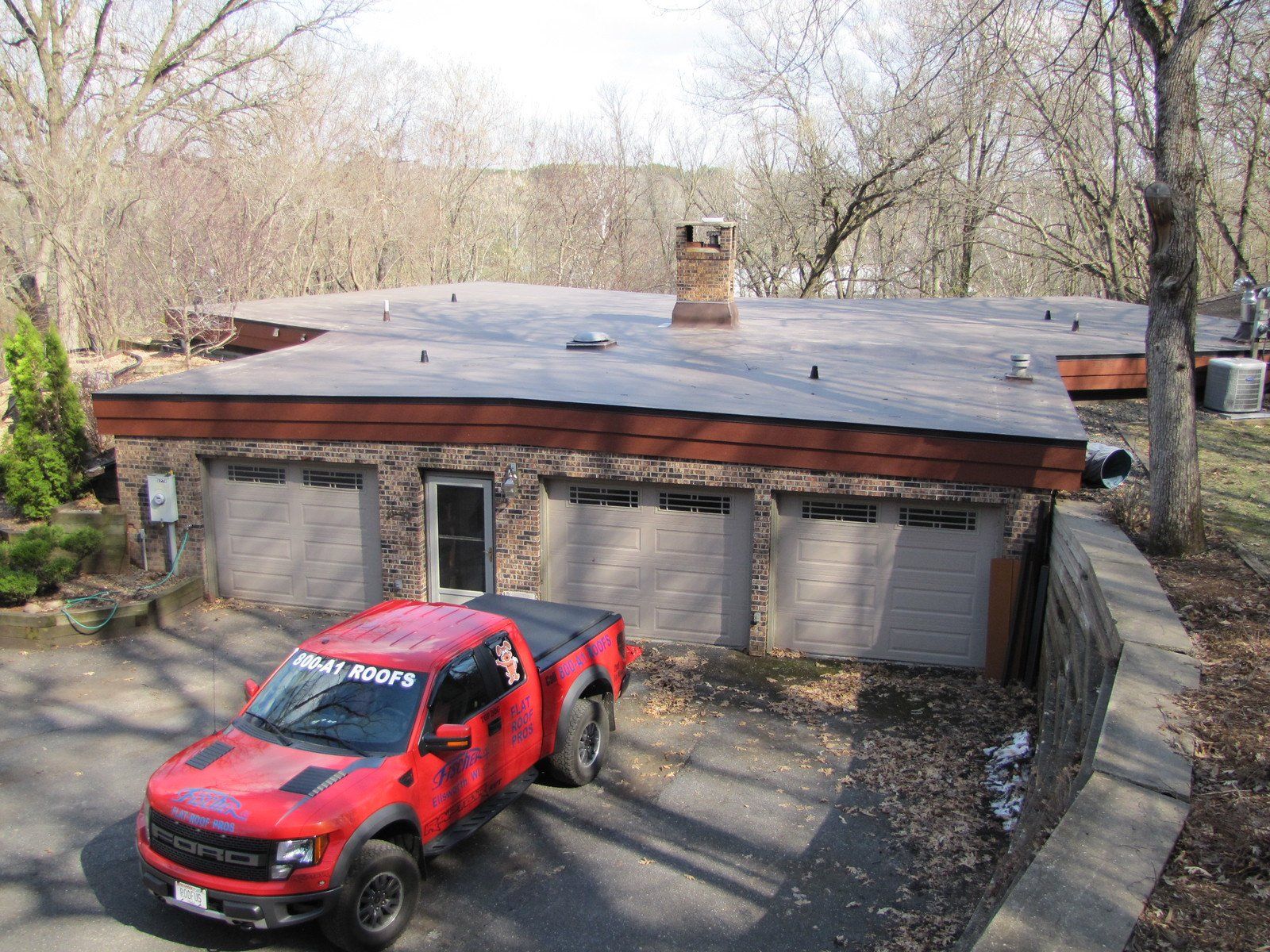 Worker Installing Asphalt On Roof — Ellsworth, WI — Fischer Roofing