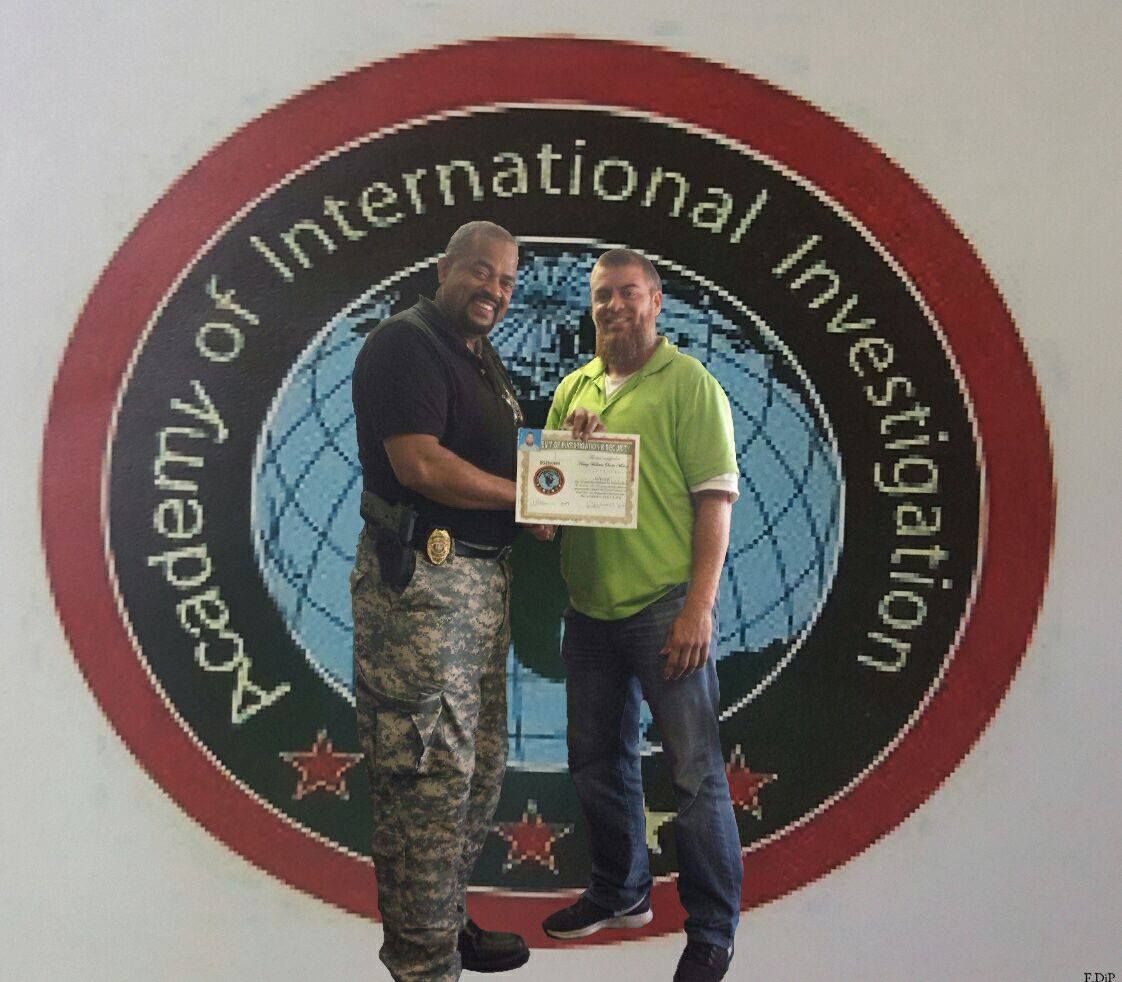 Two men standing in front of an academy of international investigation logo