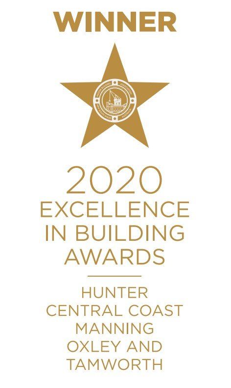 Gold star and text announcing a winner of the 2020 Excellence in Building Awards.