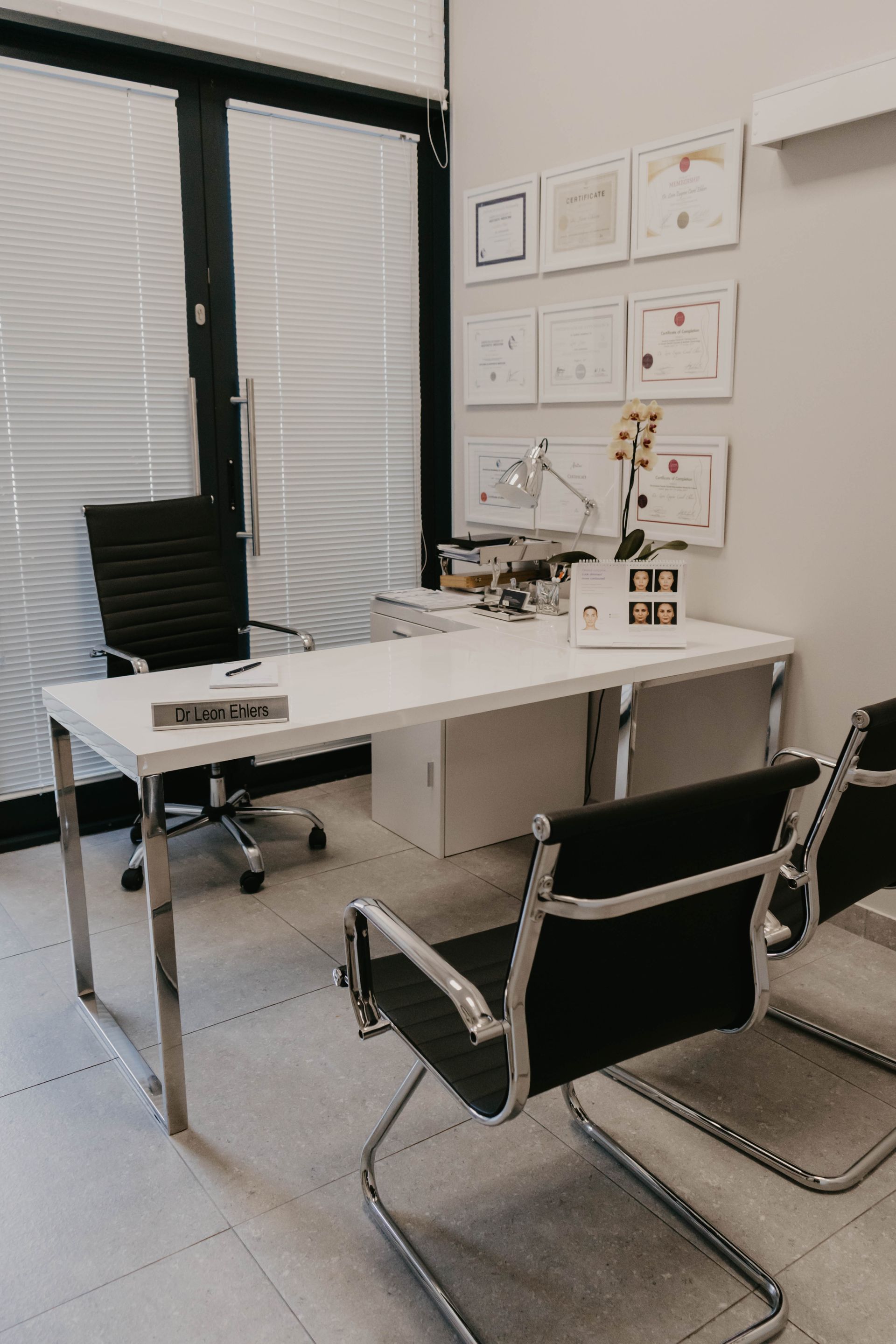 There is a desk and chairs in the room.
