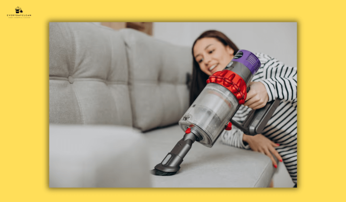 cleaning couch with vacuum
