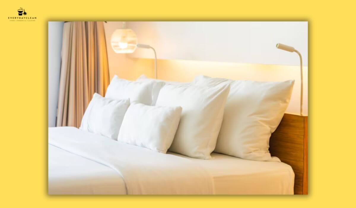fluffing pillows hotel room