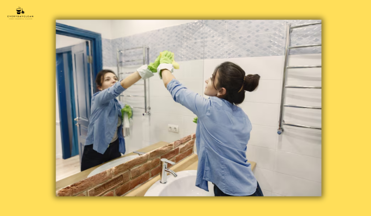 housekeeper cleaning bathroom modern apartment
