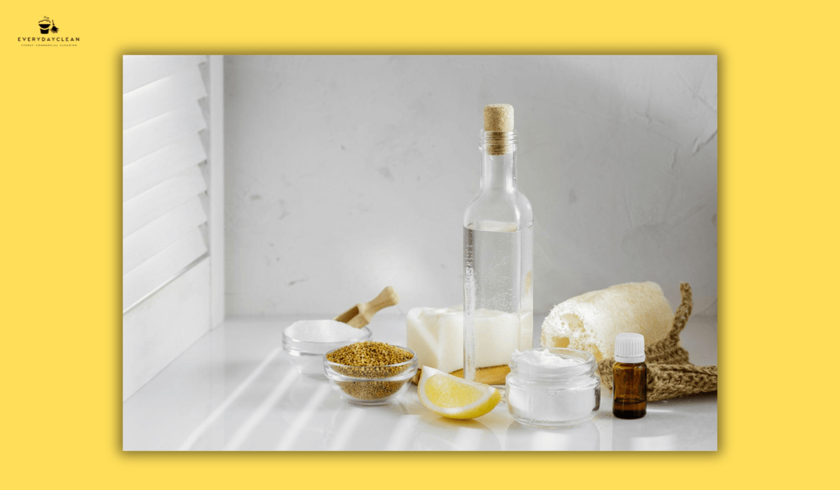 natural cleaning products set including vinegar baking soda and lemon
