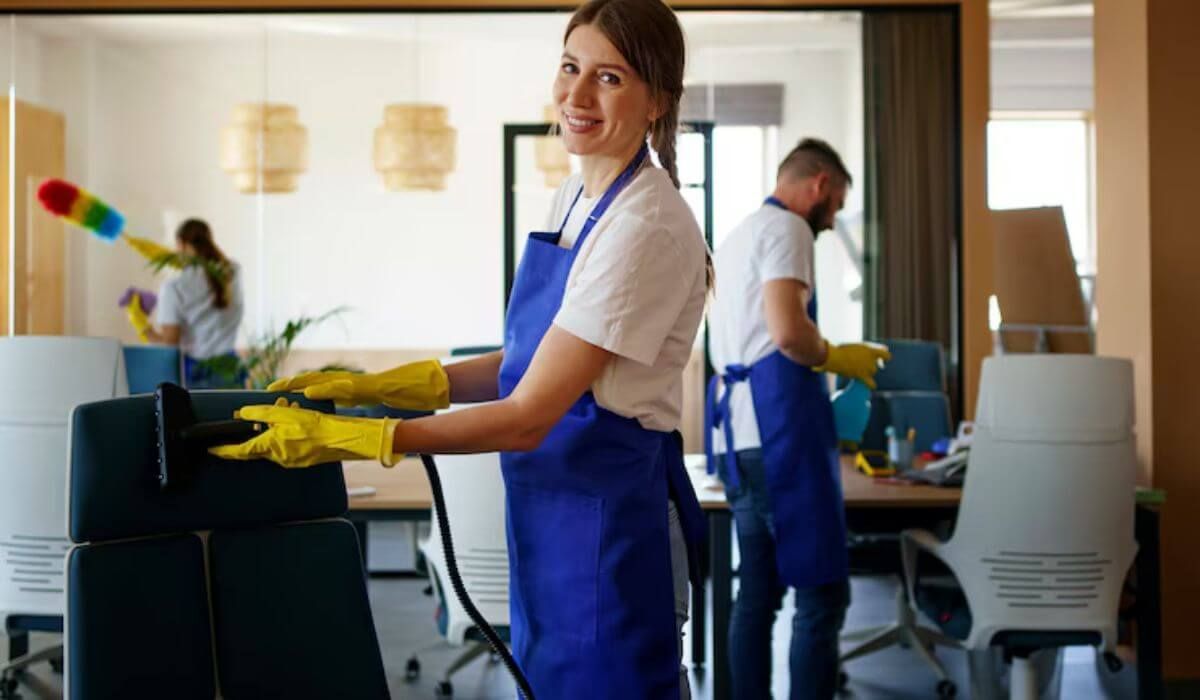 office cleaning staff with equipment