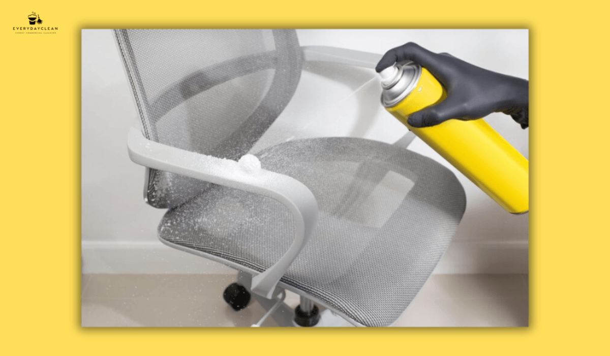 person wiping chair with cloth stain removal