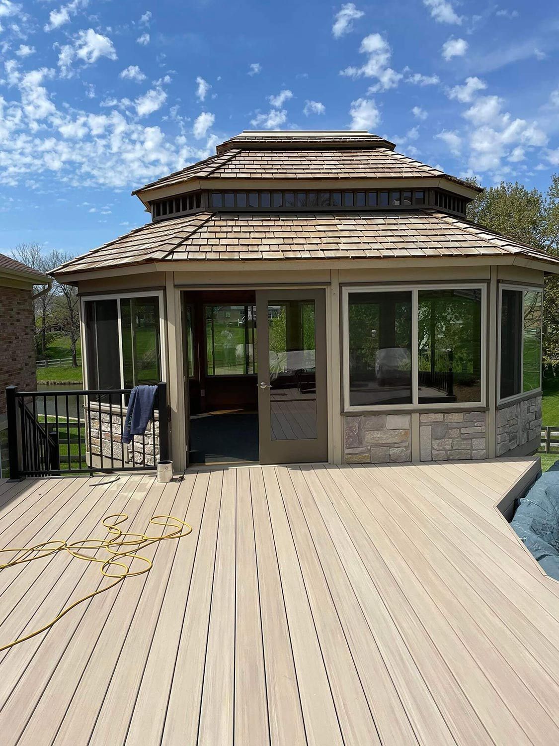 Gazebo is Sitting on Top of a Wooden Deck